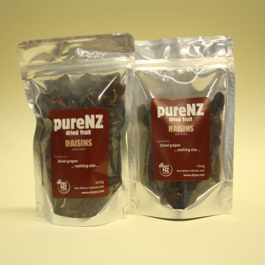 Two sealed bags of PureNZ dried grapes/raisins, one smaller and one larger, with labels indicating the product details on a white background.